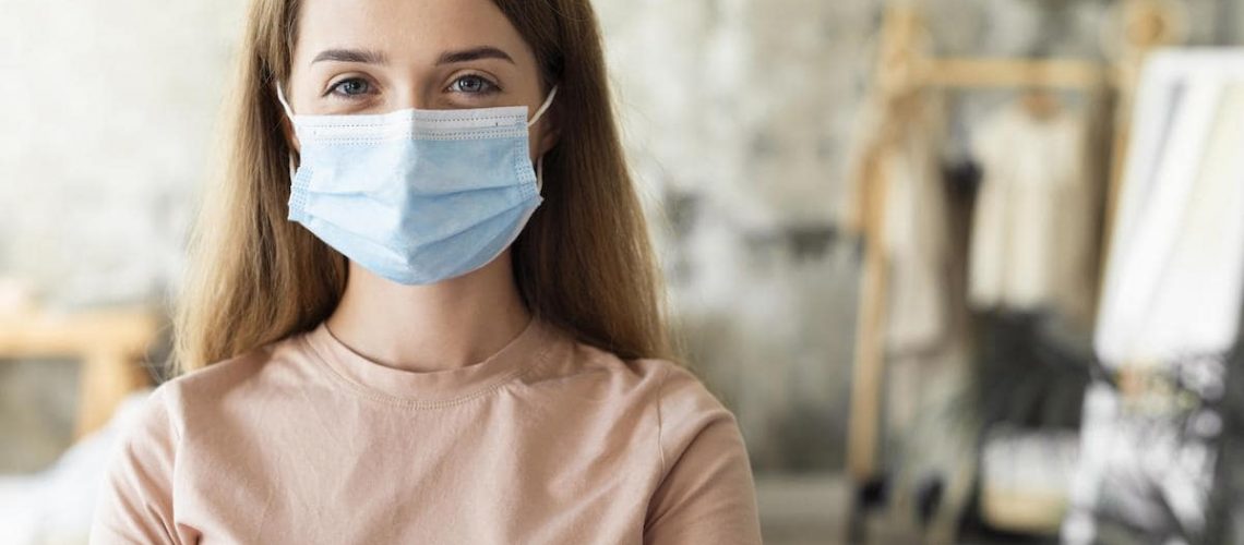 front-view-woman-wearing-medical-mask-with-copy-space (1)-min